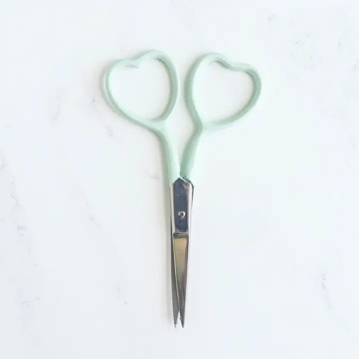 Embroidery scissors in multiple colors with heart shaped finger holes