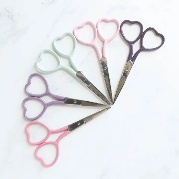 Embroidery scissors in multiple colors with heart shaped finger holes