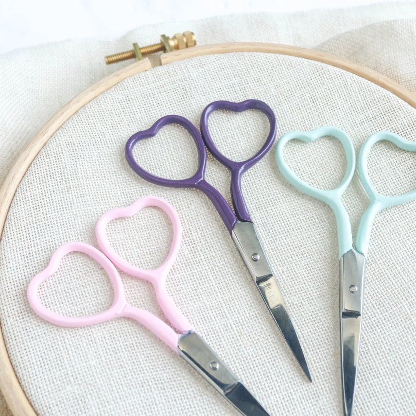 Embroidery scissors in multiple colors with heart shaped finger holes