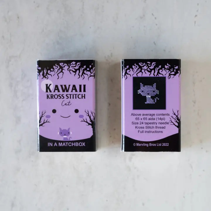 Two Kawaii Kross Stitch matchbox packaging on a light gray background