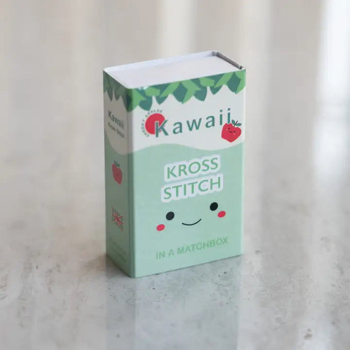 Kawaii Kross Stitch matchbox packaging on a light background