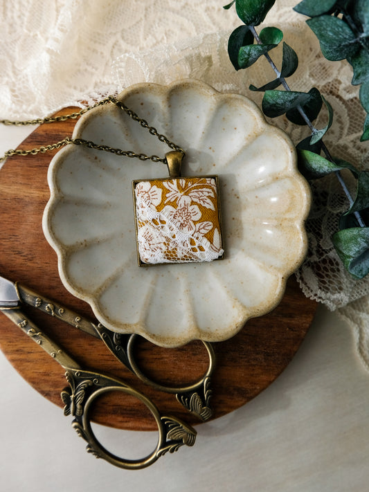 Fabric and Lace Pendant Necklace in Bronze