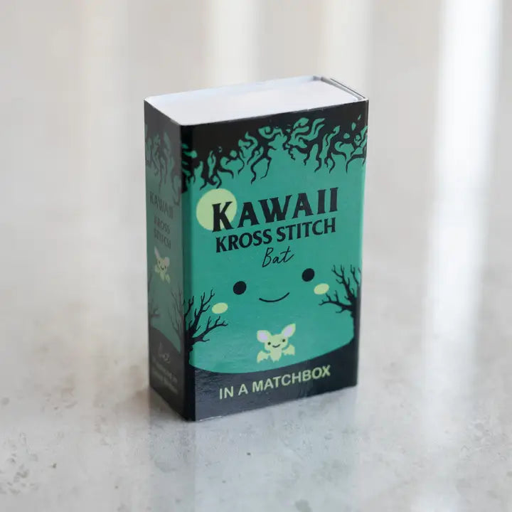 Kawaii Kross Stitch matchbox packaging on a light background